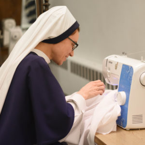 Sr. Angelina sewing