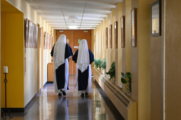 Sisters walking in hallway